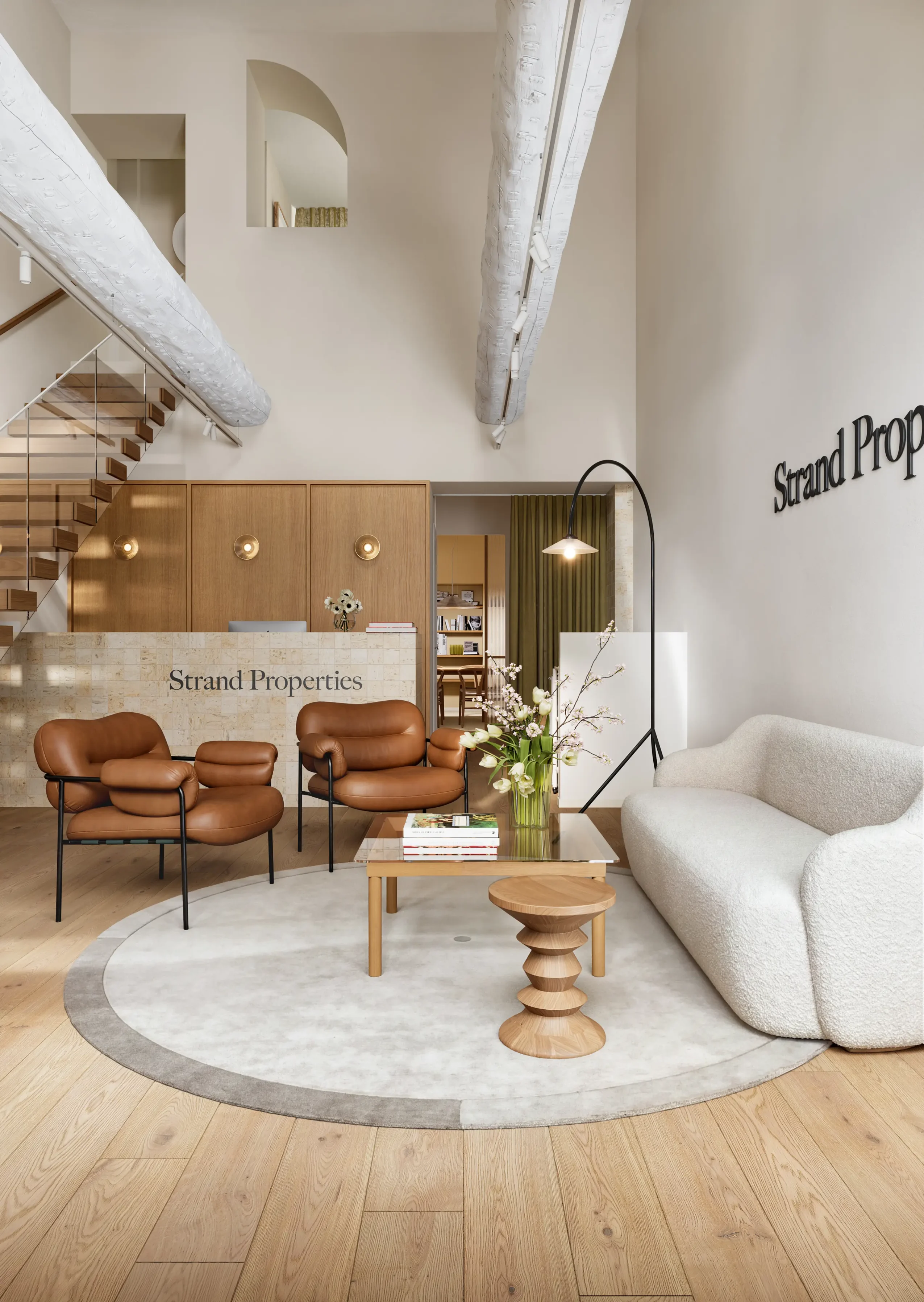 Strand Properties Nice office with an elegant Scandinavian-inspired interior and reception area.
